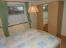 1. Schlafzimmer mit Doppelbett und Kleiderschrank
