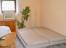 Schlafsofa - Doppelbett im Wohnküchenbereich im Souterrain
