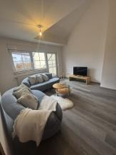 Wohnbereich mit Zugang zur Dachterrasse